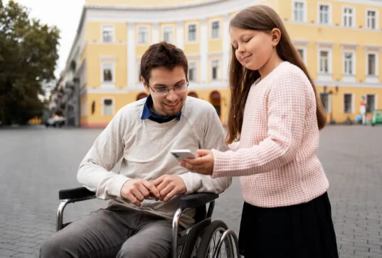 Accessible social media: a group of people with disabilities sharing content on their phones