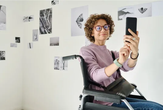 Friends with disabilities taking a photo for an accessible social media post